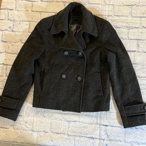 Express cashmere blend ladies’ gray waist coat. Button  closure, has pockets.